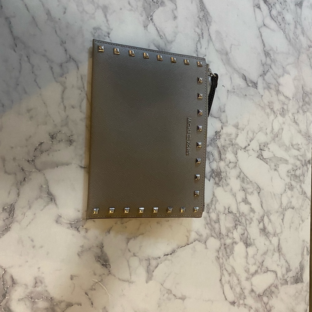 gray Michael Kors wristlet.